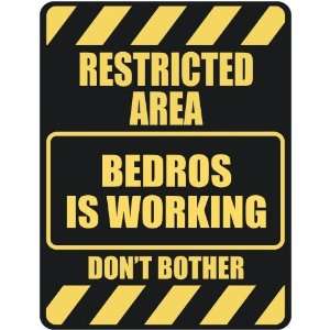   RESTRICTED AREA BEDROS IS WORKING  PARKING SIGN