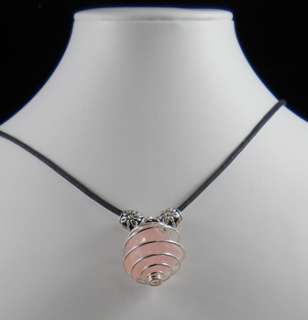   Photo Of One Of Our Necklaces Made With A Rose Quartz Spiral Pendant