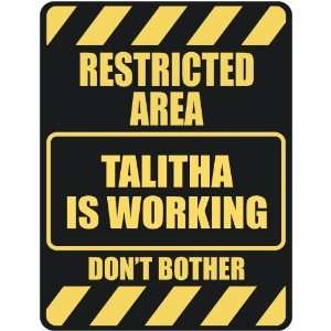   RESTRICTED AREA TALITHA IS WORKING  PARKING SIGN