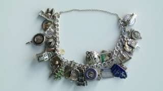 VINTAGE STERLING SILVER CHARM BRACELET LOADED WITH 30 CHARMS  