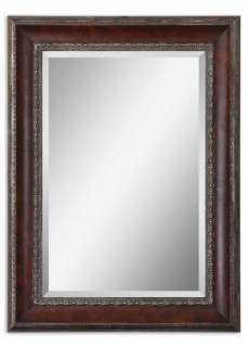 This wooden frame features a distressed, dark mahogany wood tone 