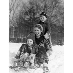  Smiling Woman, Boy and Girl Standing on a Sled in Winter 