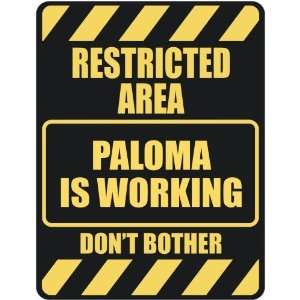   RESTRICTED AREA PALOMA IS WORKING  PARKING SIGN