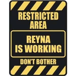     RESTRICTED AREA REYNA IS WORKING  PARKING SIGN
