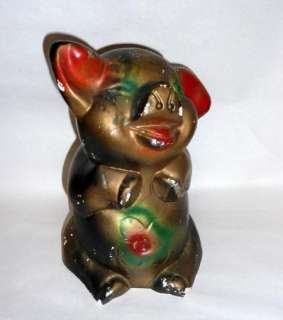 The chalkware pig has many small surface chips but they are mostly in 