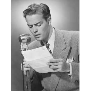  Elegant Man Talking Into Microphone in Studio Photographic 