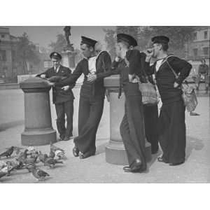  Officer and Several British Sailors Feeding the Pigeons in 