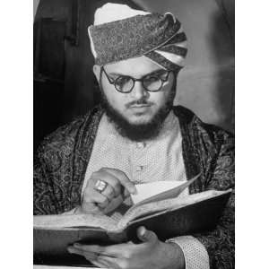 Portrait of Turban Clad Hindu Man Wearing Glasses and Reading a Book 